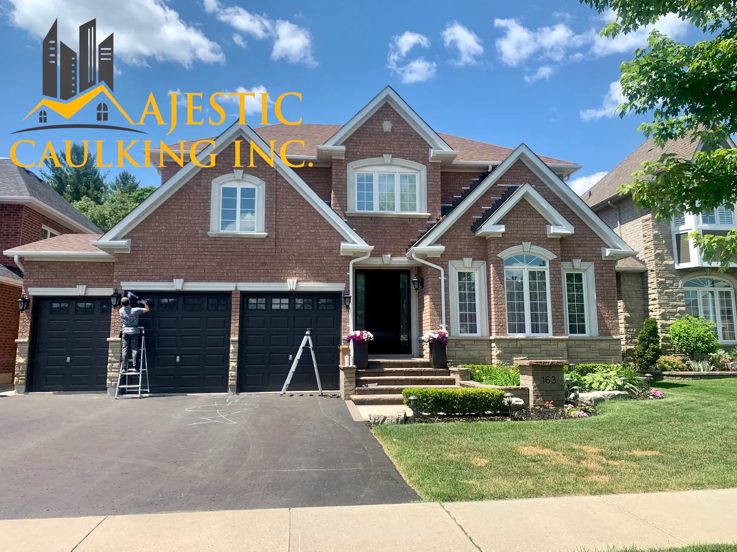 Worker caulking a window